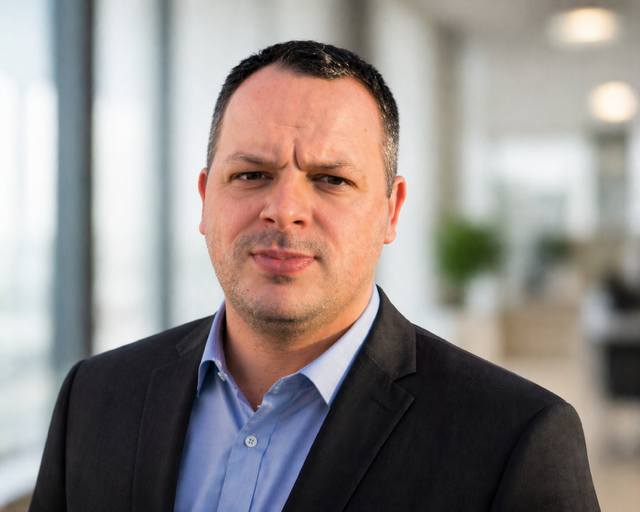 Portrait of Caleb Tharp, creator of the Plumbline Trading Suite